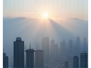 Ethereal misty morning over Toronto in fall, seen from CN Tower at sunrise.