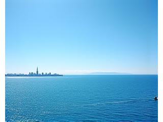 Boats on Lake Ontario during a clear summer day, stretching to the horizon from CN Tower.